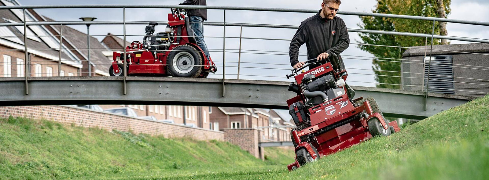 Man riding stand on commercial mower