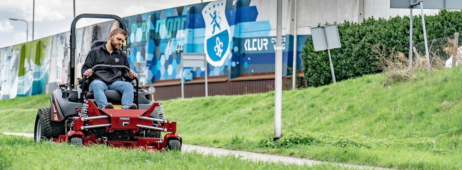 Man riding  zero turn commercial mower