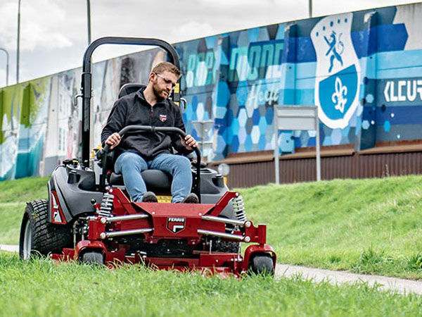 Man riding  zero turn commercial mower