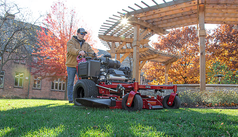 Man pushing Ferris FW45 walk behind mower