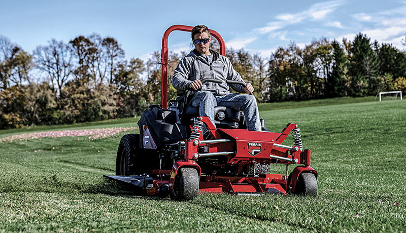 Man riding a Ferris zero turn mower